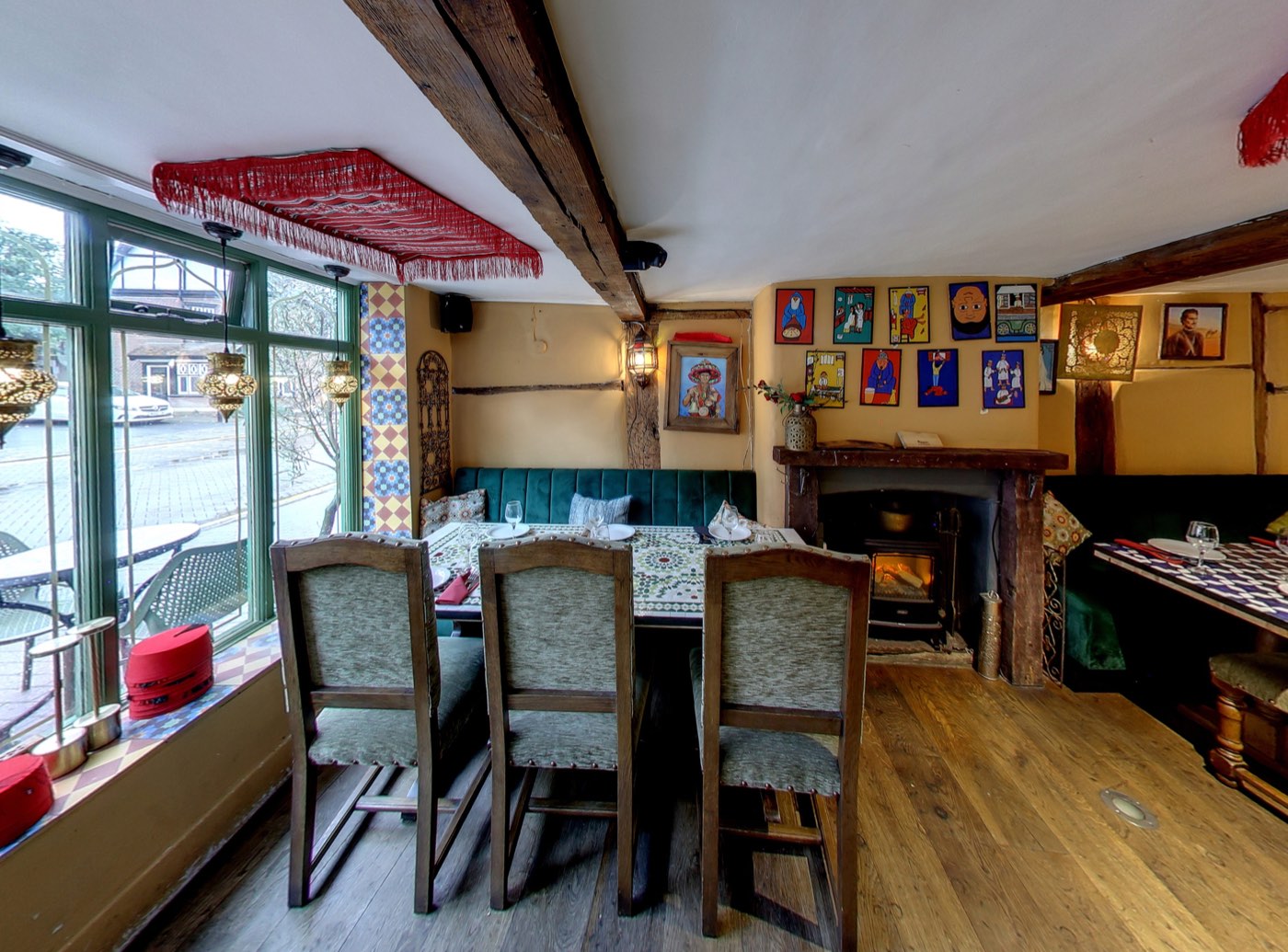 Cosy dining area with fireplace at Tarboush Tring, Tring